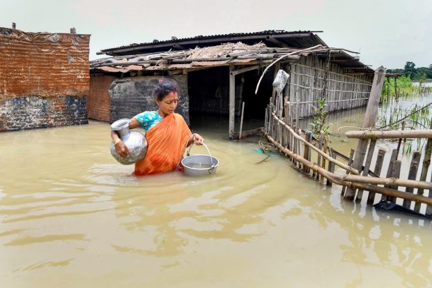 Brahmaputra and Barak rivers along with its tributaries are in spate in most of the affected districts and vast tracts of land remained inundated in 32 of the total 36 districts in the state. (PTI Photo)