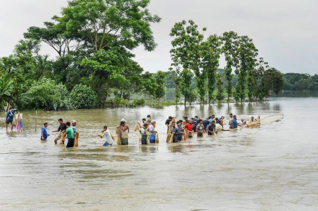 The Barak Valley districts - Cachar, Hailakandi and Karimganj were severely hit by the rising water of Barak and Kushiara rivers. (PTI Photo)