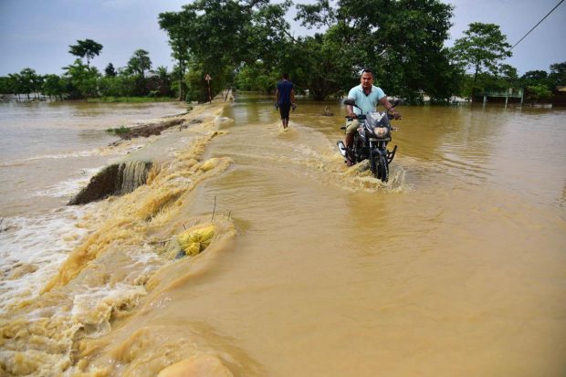 The worst affected districts are Barpeta where 11,29,390 are affected, followed by Kamrup with 7,89,496, Dhubri with 5,97,153 and Nagaon with 5,03,450 people in the flood. (PTI Photo)