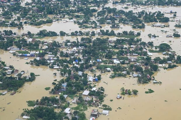 Aerial view of the flood-affected area as seen by Assam Chief Minister Himanta Biswa Sarma during his survey, in Silchar. (PTI Photo)