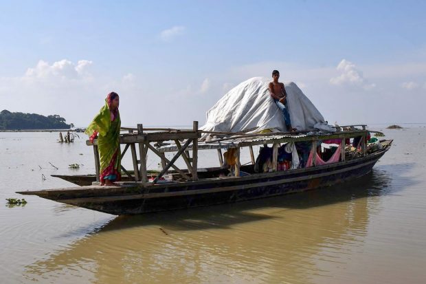 The flood has damaged 218 roads and 20 bridges, besides breaching two embankments in Kamrup district. (PTI Photo)