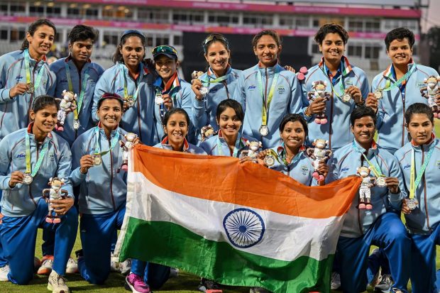 Indian women's cricket team players pose for photographs with their silver medals and the tricolor during the medal ceremony at the Commonwealth Games 2022, Edgbaston Cricket Ground in Birmingham, UK. (PTI Photo)