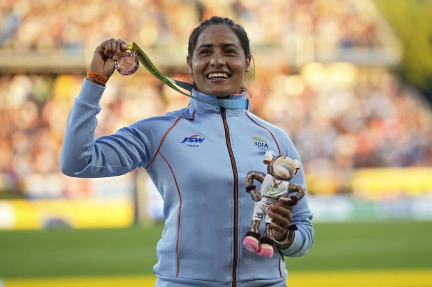 Annu Rani of India poses on the podium of after winning the bronze medal in Women's javelin throw during the athletics competition in the Alexander Stadium at the Commonwealth Games in Birmingham, England. (AP Photo)