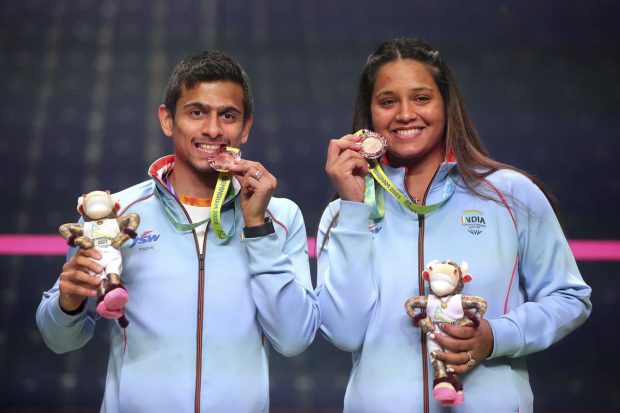 Saurav Ghosal and Dipika Pallikal Kartik pose with their bronze medals after finishing third at the University of Birmingham Hockey and Squash Centre on day ten of the 2022 Commonwealth Games in Birmingham, England. (AP Photo)