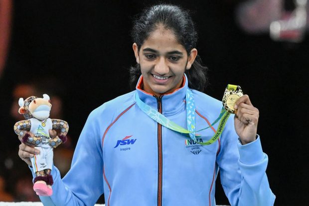 Gold medalist India's Nitu Ghanghas poses for photographs during the presentation ceremony of the women's over 45-48kg (Minimumweight) boxing event, at the Commonwealth Games 2022 (CWG) in Birmingham, UK. (PTI Photo)