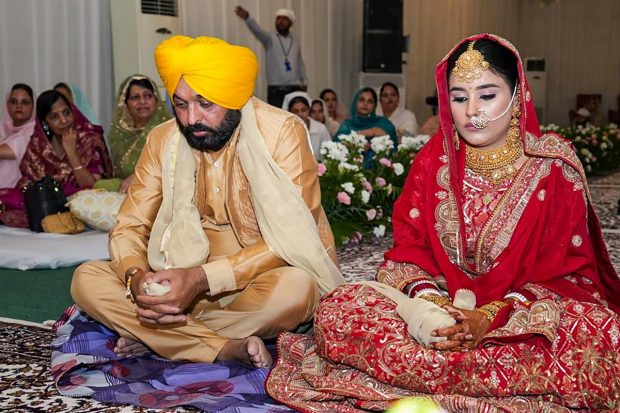 The regular 'band, bajaa, baraat' were missing but the festivities seemed intact as Punjab Chief Minister Bhagwant Mann turned groom for his wedding with a doctor from Kurukshetra at his home in Chandigarh on Thursday. Mann (48), the first chief minister of the state to get married while in office, is tying the knot with Dr Gurpreet Kaur from Pehowa in Kurukshetra in Haryana. Let us take a look at some of the images from Anand Karaj ceremony: