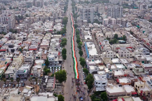 Ahmedabad: Students carry a giant Indian national flag as they participate in a 'Tiranga Yatra', oraganised as part of 'Azadi ka Amrit Mahotsav' celebrations commemorating 75 years of India's Independence, in Ahmedabad. (PTI Photo)