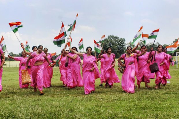 Bal Vikas Evam Pustahar department employees carry the national flag during a programme as part of 'Har Ghar Tiranga' campaign, in Meerut. (PTI Photo)