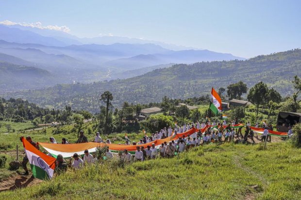 Indian Army personnel with locals participate in a 'Tiranga Yatra' ahead of the 75th Independence Day, near Line of Control (LoC) at Mendhar sector in Poonch. (PTI Photo)