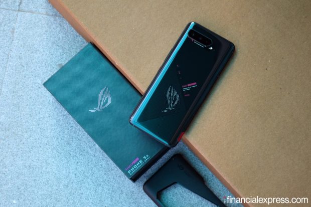 Asus has unleashed its latest and greatest ROG gaming phones in India. These are the ROG Phone 5s and ROG Phone 5s Pro. They’re the same phones, mostly, with the only differences coming by way of design. Core hardware is similar across the board which actually makes the ROG Phone 5s quite exciting, considering its lower pricing. At the same time, you should know, these phones are also very similar to the ROG Phone 5 and ROG Phone 5 Ultimate launched last year in the country. While we work on our full review of the ROG Phone 5s, here’s a quick first look at its design, specs, and everything else you need to know. (Photo credit: Saurabh Singh/Financial Express)