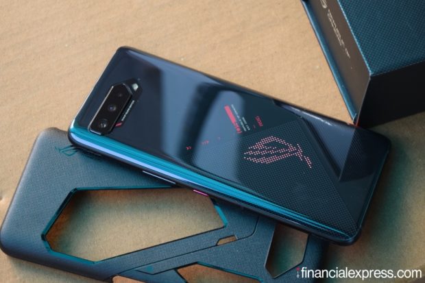 The ROG Phone 5s has a back made of glossy Corning Gorilla Glass 3. The ROG logo has RGB lighting that you can also customise using a built-in app. The sides are made of metal. There are a total of two USB C ports in this phone. There is a pogo pin connector to hook it to first-party accessories like the Asus AeroActive Cooler. Asus has retained the headphone jack. (Photo credit: Saurabh Singh/Financial Express)