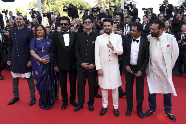 Ricky Kej, from left, Vani Tripathi, R. Madhavan, Prasoon Joshi, Anurag Thakur, Nawazuddin Siddiqui, and Shekhar Kapur pose for photographers upon arrival at the opening ceremony and the premiere of the film 'Final Cut' at the 75th international film festival, Cannes, southern France. (AP Photo)