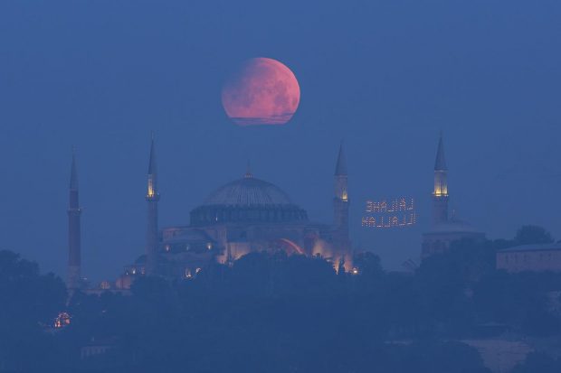 A full moon rises above the iconic Haghia Sophia in Istanbul, Turkey. (AP Photo)