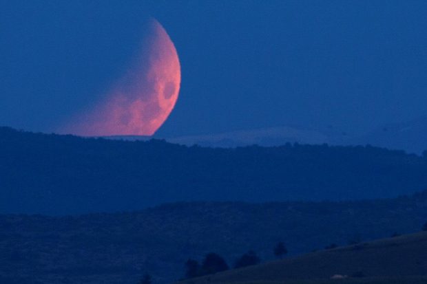 The moon is seen during lunar eclipse in Skopje, North Macedonia. (Reuters Photo)