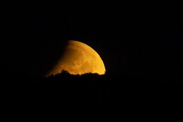 The moon is seen during lunar eclipse in Skopje, North Macedonia. (Reuters Photo)