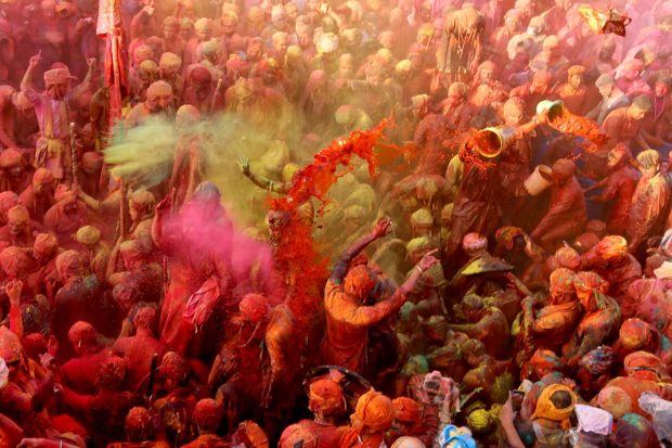 People daubed with colours during the Lathmar Holi celebrations at Nandgaon, in Mathura. (PTI Photo)