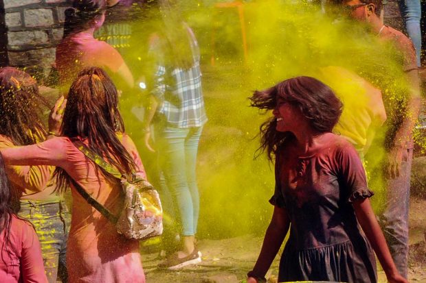 Young people play with colours during the celebration of the upcoming Holi festival, in Ranchi. (PTI Photo)