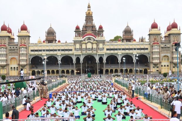 The assembled crowd follows Prime Minister Narendra Modi during the International Day of Yoga event in Mysuru. (Twitter/Narendra Modi)