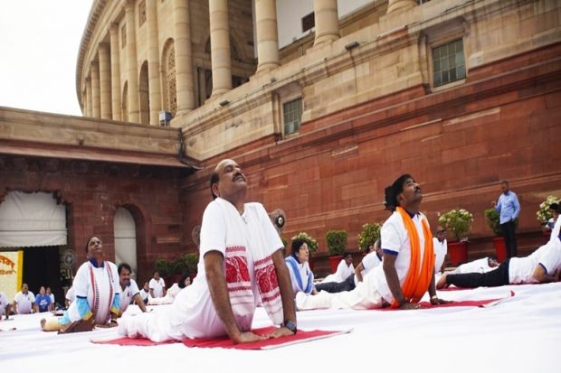 Lok Sabha Speaker Om Birla leads a ‘Yoga Shivir’ at Parliament House Complex in New Delhi. Several Members of Parliament and dignitaries attended the shivir. (Twitter/All India Radio News)