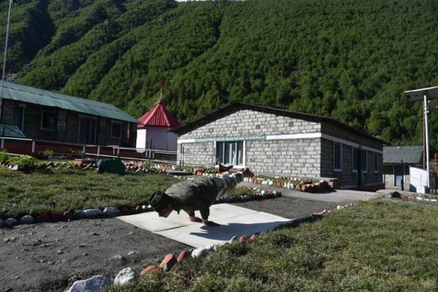 Personnel of the Indo-Tibetan Border Police, 2nd Battalion, practises a yoga pose in Himachal Pradesh. (Twitter/Indo-Tibetan Border Police)