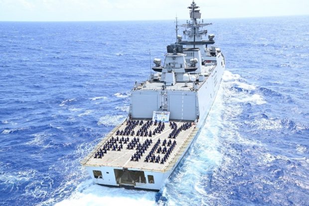 Personnel on INS Satpura, the easternmost deployed Indian Navy warship, operating in the Pacific Ocean, practise yoga on the ship's with Common Yoga Protocol at sea. (Indian Navy/ANI)