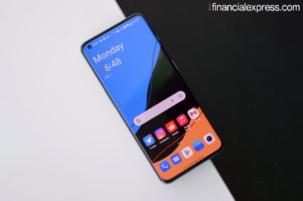 The front remains largely unchanged from the OnePlus 9 Pro. You get a 6.7-inch 1440p AMOLED display with a 120Hz refresh rate. OnePlus says it is using a second generation LTPO panel in the phone that should entail faster switching - between 1Hz-120Hz - depending on available content. (Photo credit: Saurabh Singh/Financial Express)