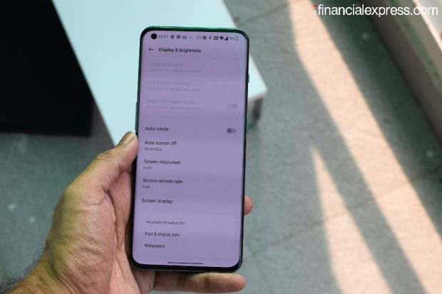 The screen features dual colour calibration for seemingly better accuracy and Corning Gorilla Glass Victus protection. Biometrics are handled by an in-display fingerprint scanner. (Photo credit: Saurabh Singh/Financial Express)