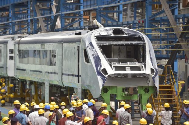 Workers busy in production of coaches of the Vande Bharat Express as media person document, at LHB Shed in Integrated Coach Factory (ICF) Chennai. (PTI Photo)