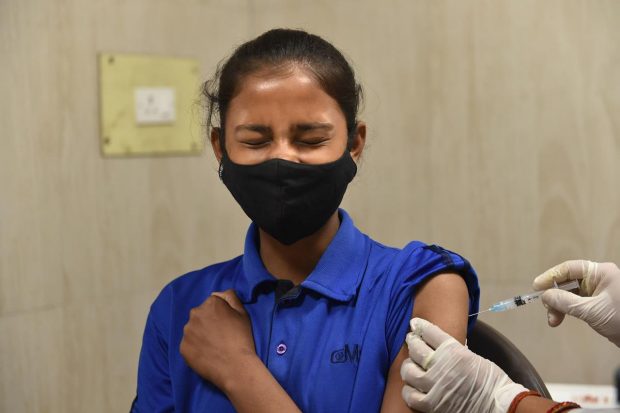 A healthcare worker administers a dose of the Covid-19 preventive vaccine to a student in the age group of 12 to 14 years, at the Civil Hospital, in Lucknow. (PTI Photo)