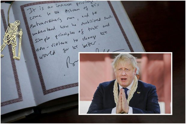 A view of the message written by Britain's Prime Minister Boris Johnson in the guest book during his visit to Gandhi Ashram in Ahmedabad. Johnson termed Mahatma Gandhi an “extraordinary man” who mobilized the principles of truth and non-violence to change the world for better. (Reuters Photo)