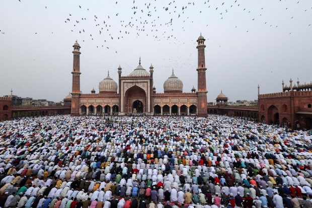 Muslims offer Eid al-Fitr prayers at Jama Masjid to mark the end of the holy fasting month of Ramadan, in old Delhi. (Reuters Photo)