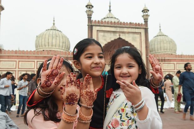 Muslim children after offering prayers at the Jama Masjid on the occasion of Eid-ul-Fitr, in old Delhi. (PTI Photo)