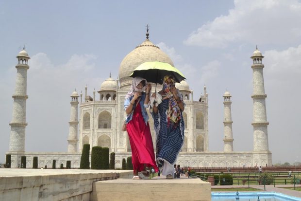 The Taj Mahal sees low footfall of tourists during noon due to the constant scorching heat on a hot summer day, in Agra. (PTI Photo)