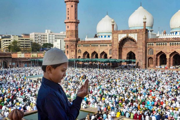 Muslims offer prayers at the historical Taj-ul Masajid on the occasion of Eid-ul-Fitr, in Bhopal. (PTI Photo)