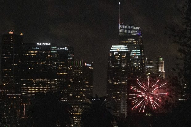 Lights and fireworks mark the start of the year 2022, after midnight, by the Wilshire Grand Center, a 1,100-foot skyscraper, in Los Angeles. (AP Photo)