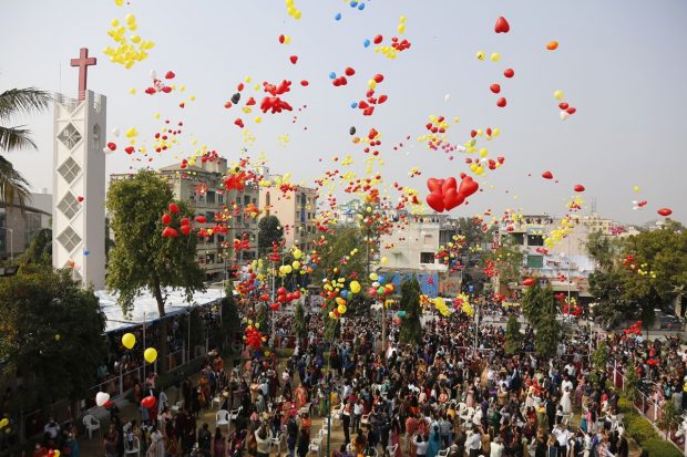 Christians release balloons to celebrate the New Year after offering prayers at a church in Ahmedabad. (AP Photo)