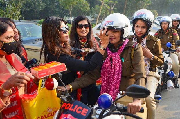 Women police personnel during a bike rally organised to mark the 'International Women's Day', in Gurugram. (PTI Photo)