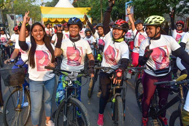 Women show victory sign as they take part in a bicycle rally to mark the International Women's Day, in Guwahati. (PTI Photo)